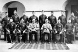 Front row 2nd left to 2nd right: Sergeant Machray, Captain and Adjutant the Honourable M.C.A. Drummond, Sergeant Major Anderson, Corporal Findlay.<br/><br/>

Before 28 March 2006, the Black Watch was an infantry regiment. The Black Watch (Royal Highland Regiment) from 1931 to 2006, and The Black Watch (Royal Highlanders) from 1881 to 1931. Part of the Scottish Division, it was the senior regiment of Highlanders.<br/><br/>

Since 2006 The Black Watch, 3rd Battalion, Royal Regiment of Scotland (3 SCOTS) has been an infantry battalion of the Royal Regiment of Scotland.
